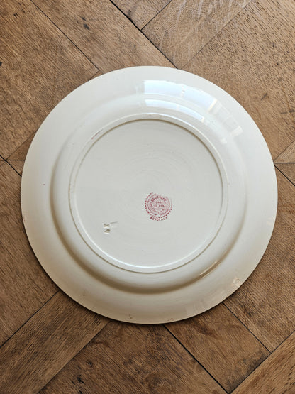 Plat rond ancien en terre de fer Hippolyte Boulenger Choisy-le-Roi, modèle Bordeaux rouge