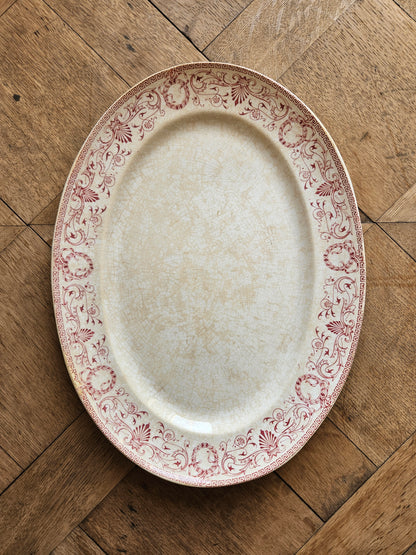 Plat ovale ancien en terre de fer Creil et Montereau, modèle Marie-Louise rouge