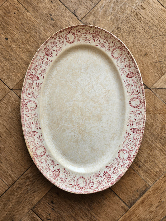 Plat ovale ancien en terre de fer Creil et Montereau, modèle Marie-Louise rouge