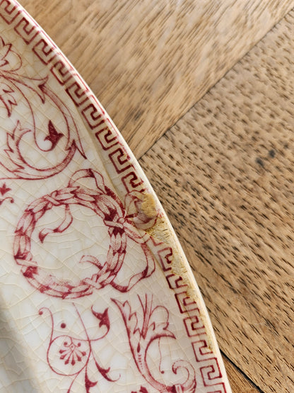 Plat ovale ancien en terre de fer Creil et Montereau, modèle Marie-Louise rouge