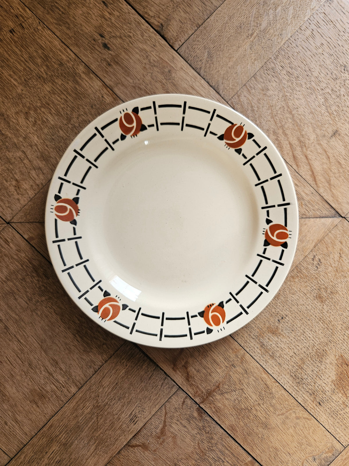Assiette plate Ste Amandinoise, noir orangé