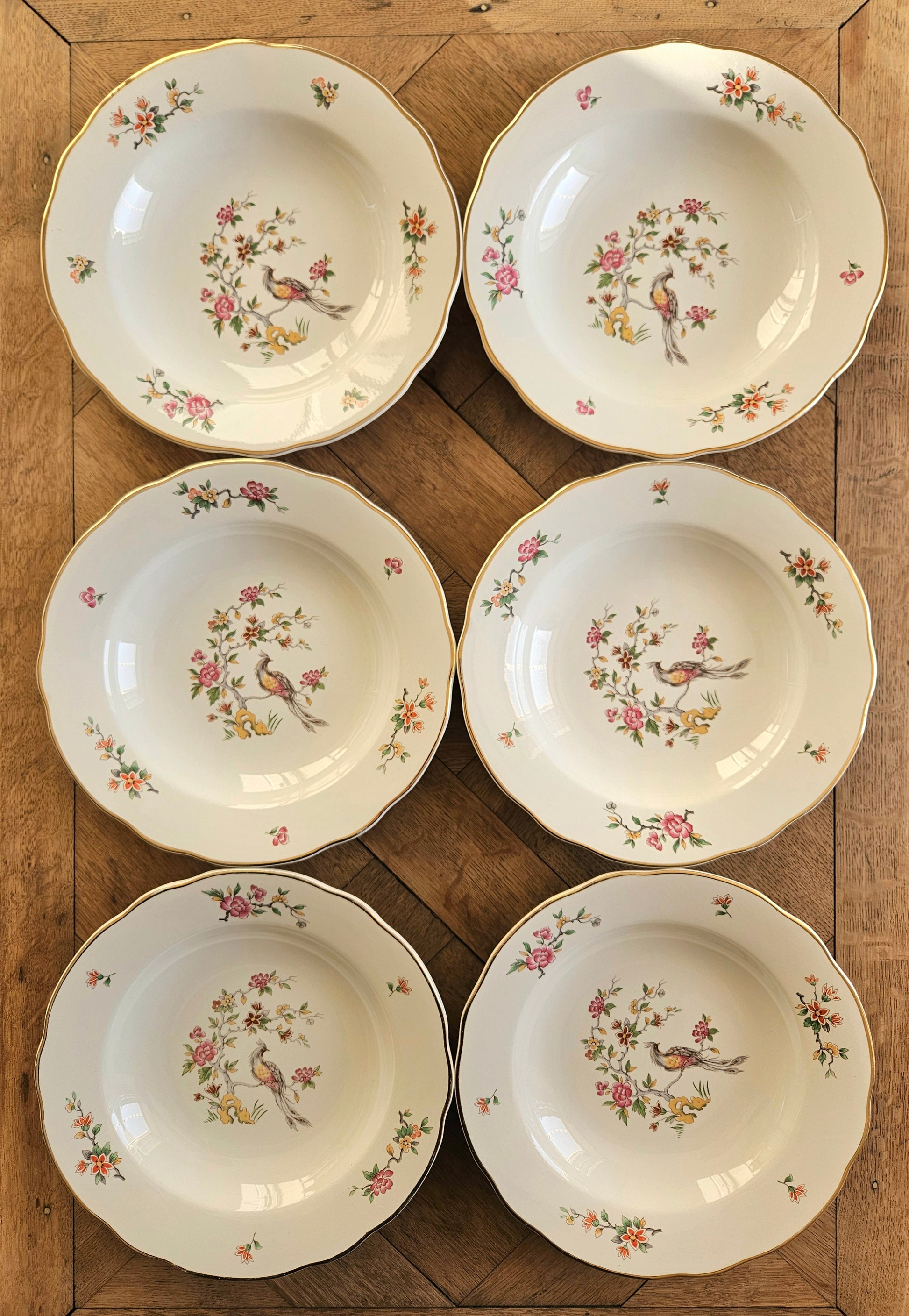 Lot de 6 assiettes creuses vintage Digoin. Modèle Condé.
Décor d’oiseau et d’arbre en fleurs.